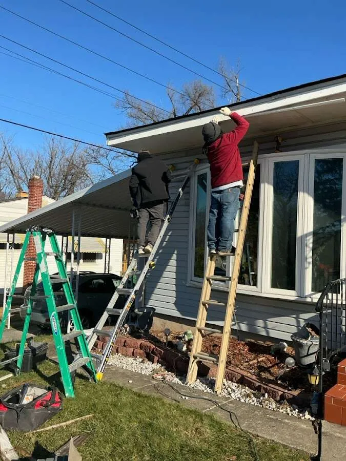 Restoration crew performing exterior repair in Victor